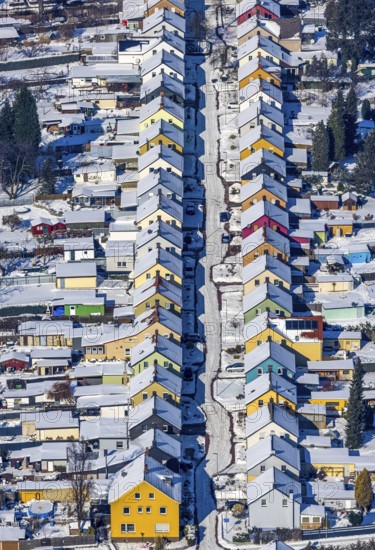 Aerial view, Friedrichstraße colliery housing estate, coloured house facades in the snow, Königsborn, Unna, Ruhr area, North Rhine-Westphalia, Germany, DE, detached houses, Europe, property tax, real estate, aerial view, aerial photography, aerial photography, terraced houses, snow, overview, bird's-eye view, winter, winter slump, winter landscape, housing estate, living and living, residential area, residential houses, quality of living, residential quarter, housing estate, birds-eyes view, overview