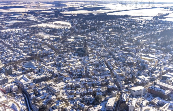 Aerial view, view of town, renovation building site Evang. City Church, Old Town, Unna, Ruhr Area, North Rhine-Westphalia, Germany, place of worship, construction work, construction area, construction site, construction project, building site, City, DE, Europe, religious community, place of worship, city centre, church, parish, church square, denomination, aerial view, aerial photography, aerial photography, religion, renovation, redevelopment, snow, townscape, city area, city centre, overview, bird's eye view, winter, onset of winter, winter landscape, birds-eyes view, overview