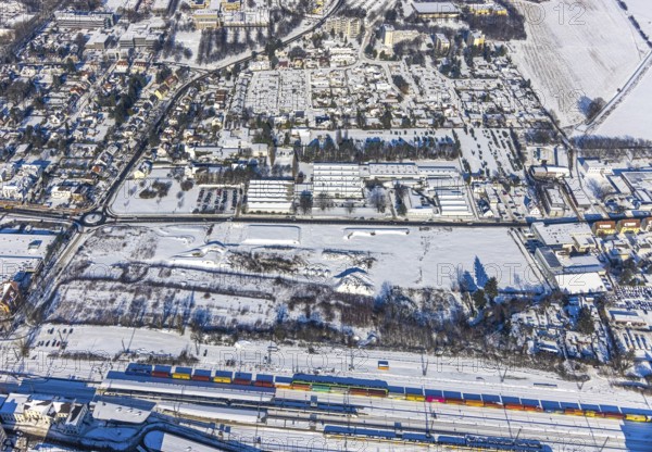 Aerial view, construction area Viktoriastrasse, Unna, Ruhr area, North Rhine-Westphalia, Germany, construction area, construction site, building plots, construction project, construction site, DE, Europe, commercial area, commercial area, commercial location, commercial use, aerial view, aerial photography, aerial photography, snow, overview, bird's eye view, winter, winter slump, winter landscape, birds-eyes view, overview