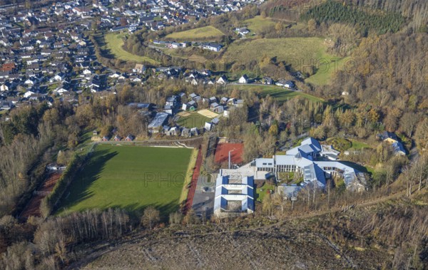 Aerial view, forest area with forest damage and sports and conference centre Hachen in the district Hachen in Sundern, Sauerland, North Rhine-Westphalia, Germany, tree dieback, bark beetle damage, bark beetle plague, DE, Europe, spruce dieback, clear-cutting, aerial view, aerial photography, aerial photography, sports field, sports centre, Sundern, overview, bird's eye view, forest, forest damage, forest dieback, birds-eyes view, overview