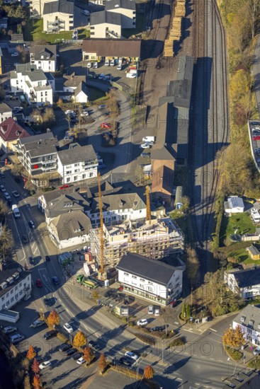 Aerial view, construction site for new building Mescheder Straße and timber loading at Sundern station in Sundern, Sauerland, North Rhine-Westphalia, Germany, railway tracks, station, construction work, construction area, building site, building plots, construction project, construction site, DE, Deutsche Bahn AG, Europe, aerial view, aerial photography, aerial photography, new building, Sundern, overview, bird's-eye view, bird's-eye view, overview