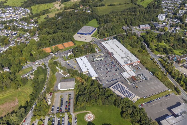 Aerial view, shopping centre with Blumen Risse and Marktkauf as well as the sports hall Schwelm in the district Büttenberg in Ennepetal, Ruhr area, North Rhine-Westphalia, Germany, DE, shopping markets, shopping place, shopping centre, Ennepetal, Europe, aerial view, aerial photography, aerial photography, local supply centre, overview, bird's-eye view, overview