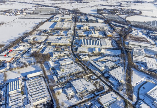 Aerial view, industrial area Soest-Ost at the federal road B475, winter, snow, Soest, Soester Börde, North Rhine-Westphalia, Germany, Soester, Börde, DE, Europe, birds-eyes, view, aerial photograph, aerial photography, aerial photography, overview, overview, bird's eye view, winter weather, winter onset, cold, B475, industry, trade, economy, commercial enterprise, production, trade, transport, traffic, infrastructure, logistics, road traffic