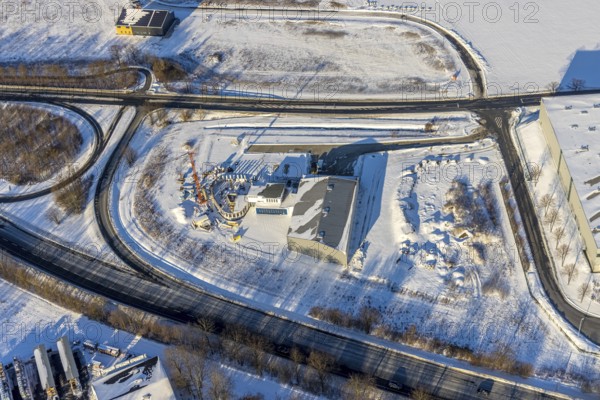 Aerial view, new construction - construction site in the industrial area - industrial area Wasserfuhr along the Opmünder Weg at the federal road B475, snow, winter, Soest, Soester Börde, North Rhine-Westphalia, Germany, Soester, Börde, DE, Europe, birds-eyes, view, aerial view, aerial photography, aerial photography, overview, overview, bird's eye view, winter weather, winter onset, cold, B475, industrial area, industry, manufacturing, production, trade, economy, commercial enterprise, trade, transport, traffic, infrastructure, logistics, road traffic