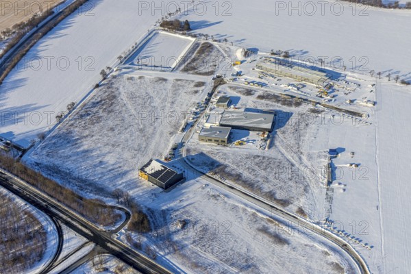 Aerial view, new construction - construction site in the industrial area - industrial area Wasserfuhr along the Opmünder Weg at the federal road B475, snow, winter, Soest, Soester Börde, North Rhine-Westphalia, Germany, Soester, Börde, DE, Europe, birds-eyes, view, aerial view, aerial photography, aerial photography, overview, overview, bird's eye view, winter weather, winter onset, cold, B475, industrial area, industry, manufacturing, production, trade, economy, commercial enterprise, trade, transport, traffic, infrastructure, logistics, road traffic