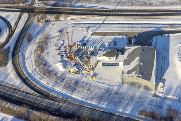 Aerial view, new construction - construction site in the industrial area - industrial area Wasserfuhr along the Opmünder Weg at the federal road B475, snow, winter, Soest, Soester Börde, North Rhine-Westphalia, Germany, Soester, Börde, DE, Europe, birds-eyes, view, aerial view, aerial photography, aerial photography, overview, overview, bird's eye view, winter weather, winter onset, cold, B475, industrial area, industry, manufacturing, production, trade, economy, commercial enterprise, trade, transport, traffic, infrastructure, logistics, road traffic