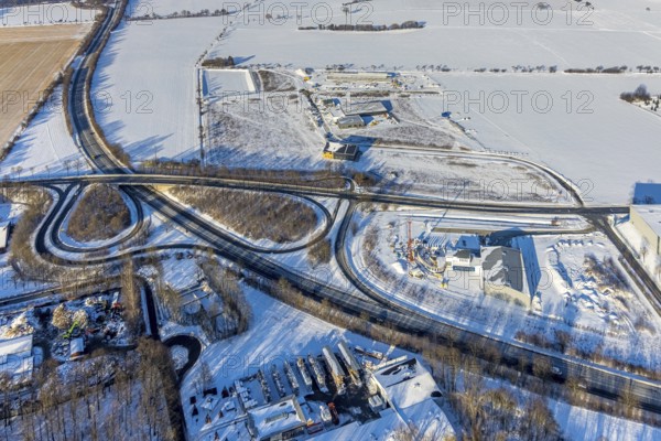 Aerial view, new construction - construction site in the industrial area - industrial area Wasserfuhr along the Opmünder Weg at the federal road B475, snow, winter, Soest, Soester Börde, North Rhine-Westphalia, Germany, Soester, Börde, DE, Europe, birds-eyes, view, aerial view, aerial photography, aerial photography, overview, overview, bird's eye view, winter weather, winter onset, cold, B475, industrial area, industry, manufacturing, production, trade, economy, commercial enterprise, trade, transport, traffic, infrastructure, logistics, road traffic