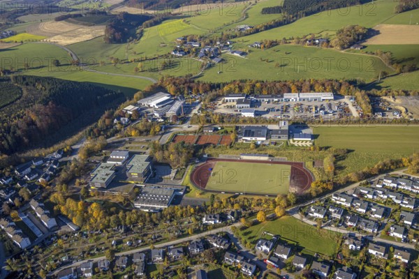 Aerial view, construction site with new building on the premises of the Feldhaus group of companies and municipal grammar school in the district of Wormbach in Schmallenberg. Gymnasium in the district of Wormbach in Schmallenberg, Sauerland, North Rhine-Westphalia, Germany, construction work, construction area, building site, building plots, construction project, construction site, education, educational institution, DE, Europe, commercial enterprises, commercial area, industrial estate, commercial location, commercial use, high school, industrial area, industrial building, industrial location, educational institute, aerial view, aerial photography, aerial photography, new building, Schmallenberg, school, overview, bird's-eye view, birds-eyes view, maschinen + technik Sauerland GmbH, overview