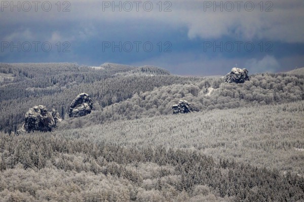 Aerial view of the rock formation Bruchhauser Steine a ground monument with four main rocks on the Istenberg in the Rothaargebirge in winter with snow in Bruchhausen in Olsberg in Sauerland in North Rhine-Westphalia, Germany, Sauerland, Europe, aerial view, birds-eyes view, aerial photography, aerial photography, overview, bird's eye view
