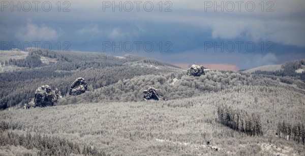Aerial view of the rock formation Bruchhauser Steine a ground monument with four main rocks on the Istenberg in the Rothaargebirge in winter with snow in Bruchhausen in Olsberg in Sauerland in North Rhine-Westphalia, Germany, Sauerland, Europe, aerial view, birds-eyes view, aerial photography, aerial photography, overview, bird's eye view