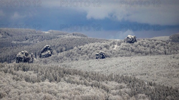 Aerial view of the rock formation Bruchhauser Steine a ground monument with four main rocks on the Istenberg in the Rothaargebirge in winter with snow in Bruchhausen in Olsberg in Sauerland in North Rhine-Westphalia, Germany, Sauerland, Europe, aerial view, birds-eyes view, aerial photography, aerial photography, overview, bird's eye view