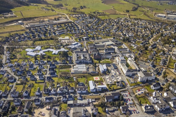 Aerial view, local view Bigge, Josefsheim Bigge, Elisabeth-Klinik Bigge, Josefs Brauerei, Olsberg, Sauerland, North Rhine-Westphalia, Germany, DE, Europe, health care, property tax, Heinrich-Sommer-Straße, hospital, helipad, real estate, kindergarten new building, clinic, clinic centre, hospital, aerial view, aerial photography, aerial photography, medical facility, medical assistance, emergency service, nursing home, round building, overview, bird's-eye view, residential complex, living and working, living and life, residential area, residential buildings, housing estate, birds-eyes view, overview, medical care