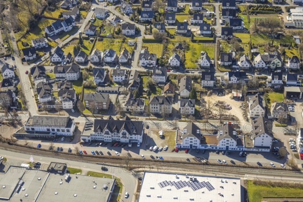 Aerial view, residential area Schulstraße, Hauptstraße with employment agency Olsberg and savings bank building, Bigge, Olsberg, Sauerland, North Rhine-Westphalia, Germany, authority, DE, Europe, property tax, real estate, aerial view, aerial photography, aerial photography, overview, bird's-eye view, living and life, residential area, residential buildings, residential quality, housing estate, birds-eyes view, overview