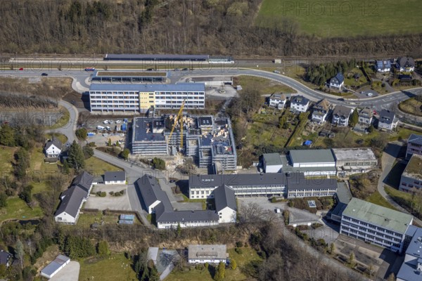 Aerial view, construction site at the vocational college Olsberg of the HSK, Olsberg railway station, Olsberg, Sauerland, North Rhine-Westphalia, Germany, railway station, construction work, construction area, construction site, construction project, construction site, education, educational institution, DE, Deutsche Bahn AG, Europe, main station, main railway station, college school, teaching institute, aerial view, aerial photography, aerial photography, school, overview, bird's-eye view, overview