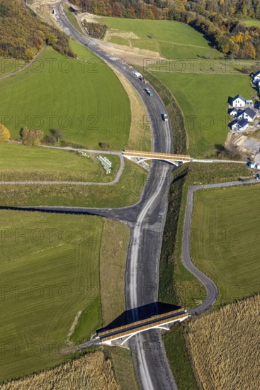 Aerial view, construction site and new construction of the bypass road L776n in the district Fredeburg in Schmallenberg, Sauerland, North Rhine-Westphalia, Germany, construction work, construction, construction area, building site, building plots, construction measure, construction project, construction site, DE, Europe, aerial view, aerial photography, aerial photography, new construction, Schmallenberg, road construction work, road construction measure, overview, bird's eye view, overview