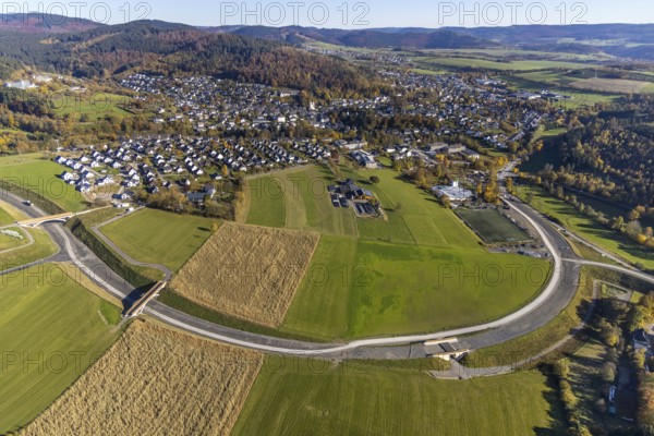 Aerial view, construction site and new construction of the bypass road L776n in the district Fredeburg in Schmallenberg, Sauerland, North Rhine-Westphalia, Germany, construction work, construction, construction area, building site, building plots, construction measure, construction project, construction site, DE, Europe, aerial view, aerial photography, aerial photography, new construction, Schmallenberg, road construction work, road construction measure, overview, bird's eye view, overview