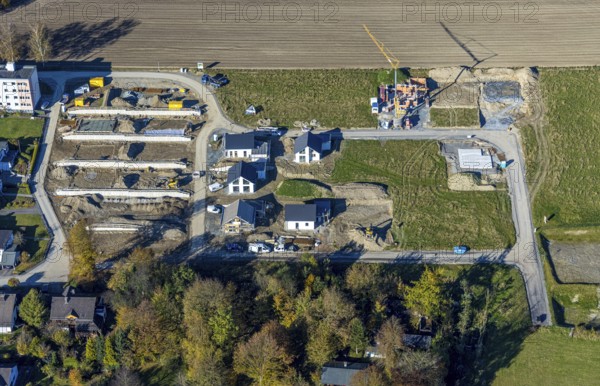 Aerial view, construction site and new construction of residential buildings on Breslauer Straße in Schmallenberg, Sauerland, North Rhine-Westphalia, Germany, construction work, construction area, building plots, construction project, construction site, DE, Europe, property tax, real estate, aerial view, aerial photography, aerial photography, new construction, Schmallenberg, overview, bird's eye view, residential complex, living and living, residential area, residential buildings, residential quality, residential neighbourhood, housing estate, birds-eyes view, overview, retaining walls