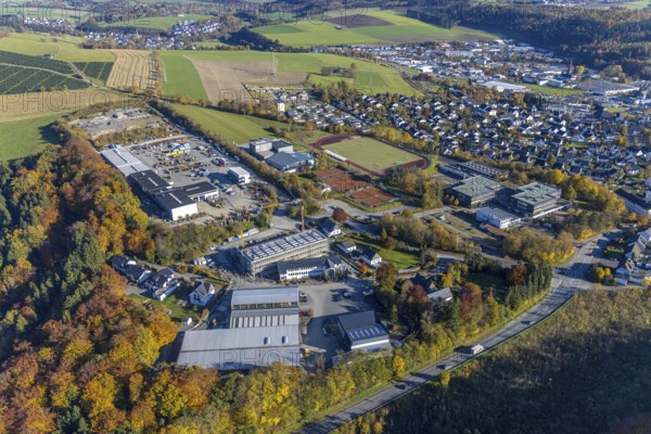 Aerial view, construction site with new building on the premises of the Feldhaus group of companies and municipal grammar school in the district of Wormbach in Schmallenberg. Gymnasium in the district of Wormbach in Schmallenberg, Sauerland, North Rhine-Westphalia, Germany, construction work, construction area, building site, building plots, construction project, construction site, education, educational institution, DE, Europe, commercial enterprises, commercial area, industrial estate, commercial location, commercial use, high school, industrial area, industrial building, industrial location, educational institute, aerial view, aerial photography, aerial photography, new building, Schmallenberg, school, overview, bird's-eye view, birds-eyes view, maschinen + technik Sauerland GmbH, overview