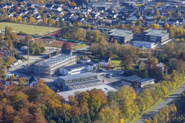 Aerial view, construction site with new building on the premises of the Feldhaus group of companies and municipal grammar school in the district of Wormbach in Schmallenberg. grammar school in the district of Wormbach in Schmallenberg, Sauerland, North Rhine-Westphalia, Germany, construction work, construction area, building site, building plots, construction project, building site, education, educational institution, DE, Europe, commercial enterprises, commercial area, commercial site, commercial use, grammar school, industrial area, industrial building, industrial site, educational institute, aerial photograph, aerial photography, aerial photography, new building, Schmallenberg, school, overview, bird's eye view, bird's eye view, overview