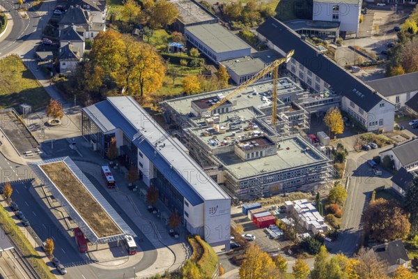 Aerial view, bus station and construction work at the vocational college Olsberg of the HSK in Olsberg, Sauerland, North Rhine-Westphalia, Germany, construction work, construction project, construction site, vocational college, vocational school, education, educational institution, bus station, bus stop, DE, Europe, educational institute, aerial view, aerial photography, aerial photography, Olsberg, bus station, school, overview, bird's eye view, ZOB, birds-eyes view, overview