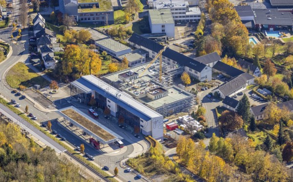 Aerial view, bus station and construction work at the vocational college Olsberg of the HSK in Olsberg, Sauerland, North Rhine-Westphalia, Germany, construction work, construction project, construction site, vocational college, vocational school, education, educational institution, bus station, bus stop, DE, Europe, educational institute, aerial view, aerial photography, aerial photography, Olsberg, bus station, school, overview, bird's eye view, ZOB, birds-eyes view, overview