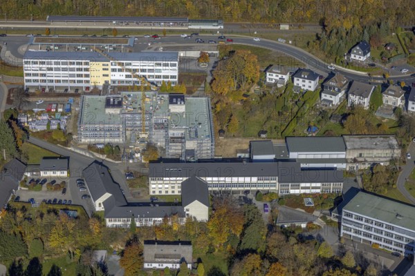 Aerial view, bus station and construction work at the vocational college Olsberg of the HSK in Olsberg, Sauerland, North Rhine-Westphalia, Germany, construction work, construction project, construction site, vocational college, vocational school, education, educational institution, bus station, bus stop, DE, Europe, educational institute, aerial view, aerial photography, aerial photography, Olsberg, bus station, school, overview, bird's eye view, ZOB, birds-eyes view, overview