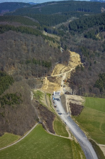 Aerial view, construction site and new construction of the L776n bypass Bad Fredeburg, Fredeburg, Schmallenberg, Sauerland, North Rhine-Westphalia, Germany, construction work, construction, construction area, construction site, building plots, construction project, construction site, bridge, DE, relief of the through road, Europe, state road L776n, aerial view, aerial photography, aerial photography, new construction, bypass, overview, bypass road, bird's-eye view, forest area, residential area, birds-eyes view, overview