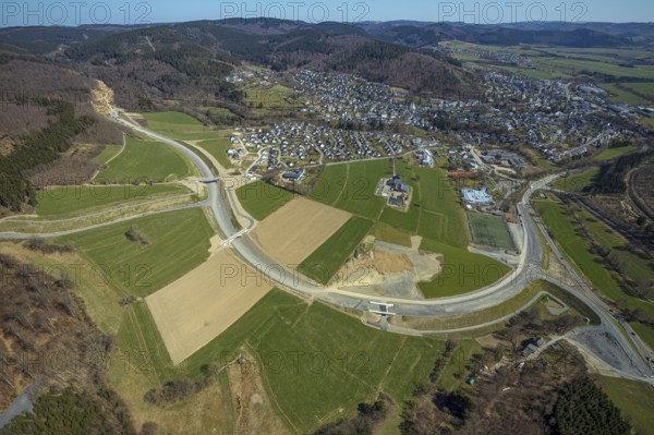 Aerial view, construction site and new construction of the L776n bypass Bad Fredeburg, Fredeburg, Schmallenberg, Sauerland, North Rhine-Westphalia, Germany, construction work, construction, construction area, building site, building plots, construction measure, construction project, construction site, bridge, DE, relief of the through road, Europe, property tax, real estate, state road L776n, aerial view, aerial photography, aerial photography, new construction, bypass, overview, bypass road, bird's eye view, forest area, residential area, housing and living, residential area, residential buildings, quality of living, birds-eyes view, overview