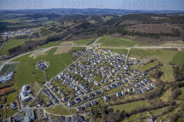Aerial view, construction site and new construction of the bypass L776n Bad Fredeburg, Fredeburg, Schmallenberg, Sauerland, North Rhine-Westphalia, Germany, construction work, construction, construction area, building site, building plots, construction project, construction site, bridge, DE, relief of the through road, Europe, long-distance view, property tax, real estate, state road L776n, aerial view, aerial photography, aerial photography, new construction, bypass, terraced houses, overview, bypass road, bird's-eye view, forest area, residential area, housing and living, residential area, residential buildings, quality of living, birds-eyes view, overview
