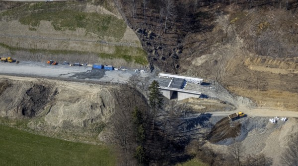 Aerial view, construction site and new construction of the L776n bypass Bad Fredeburg, Fredeburg, Schmallenberg, Sauerland, North Rhine-Westphalia, Germany, construction work, construction, construction area, construction site, building plots, construction project, construction site, bridge, DE, relief of the through road, Europe, state road L776n, aerial view, aerial photography, aerial photography, new construction, bypass, overview, bypass road, bird's-eye view, forest area, residential area, birds-eyes view, overview
