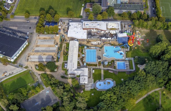 Aerial view, construction site and new construction of an indoor swimming pool at the Rheine outdoor swimming pool in Rheine-Stadt in Rheine, Münsterland, North Rhine-Westphalia, Germany, bathing establishment, bathing resort, construction work, construction area, construction site, building site, construction project, construction site, DE, Europe, outdoor swimming pool, indoor swimming pool, aerial view, aerial photography, aerial photography, new construction, Rheine, swimming pool, overview, bird's eye view, overview