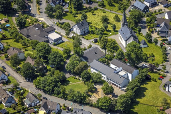 Aerial view, catholic primary school Franz-Hitze-Schule, church St. Cyriakus, Rhode, Olpe, Sauerland, North Rhine-Westphalia, Germany, place of worship, education, educational institution, DE, Europe, religious community, place of worship, primary school, holy place, church, parish, denomination, educational institute, aerial view, aerial photography, aerial photography, religion, religious site, school, overview, bird's eye view, birds-eyes view, overview
