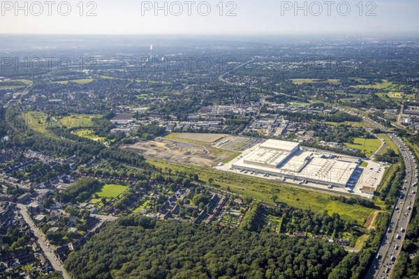 Aerial view, Edeka central warehouse Oberhausen with fallow land and Sterkrade colliery in the district of Schwarze Heide in Oberhausen, Ruhr area, North Rhine-Westphalia, Germany, construction area, building site, building plots, DE, Europe, commercial enterprises, commercial area, commercial park, commercial location, commercial use, freight traffic, industrial area, industrial building, industrial site, logistics, logistics service, logistics service provider, logistics provider, logistics centre, aerial view, aerial photography, aerial photography, Oberhausen, transport service, overview, bird's eye view, colliery, birds-eyes view, overview