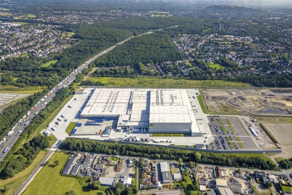 Aerial view, Edeka central warehouse Oberhausen with fallow land in the district Schwarze Heide in Oberhausen, Ruhr area, North Rhine-Westphalia, Germany, construction area, building site, building plots, DE, Europe, commercial enterprises, commercial area, commercial park, commercial location, commercial use, freight traffic, industrial area, industrial building, industrial site, logistics, logistics service, logistics service provider, logistics provider, logistics centre, aerial view, aerial photography, aerial photography, Oberhausen, transport service, overview, bird's-eye view, birds-eyes view, overview