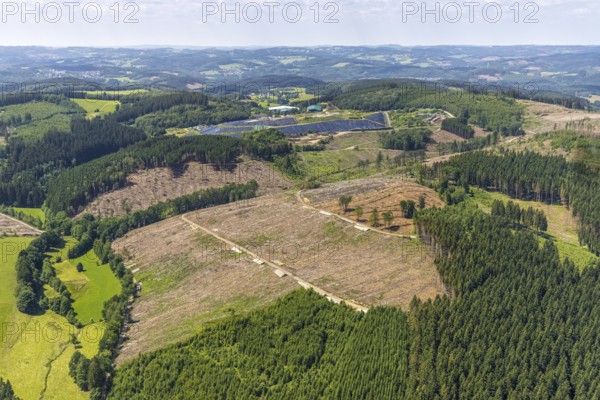 Aerial view, forest area with forest damage and clear cutting, area covered with plastic tarpaulins of the landfill Olper Entsorgungszentrum GmbH, Oberveischede Unterneger, Oberveischede, Olpe, Sauerland, North Rhine-Westphalia, Germany, waste, tree mortality, tree trunks, bark beetle plague, DE, landfill* Germany, drought, Europe, spruce mortality, aerial photograph, aerial view, aerial photography, aerial dump, hilly landscape, clear-cut, clear-cutting, compost, composting plant Olpe, storage, aerial photograph, aerial photography, aerial photography, aerial photography, waste, Neuenwald, recycling, recycling centre, collection point, drought, overview, sealing, recycling, bird's-eye view, forest, forest area, forest damage, forest damage, forest dieback, water shortage, birds-eyes view, overview