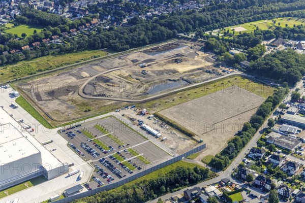 Aerial view, Edeka central warehouse Oberhausen with fallow land in the district Schwarze Heide in Oberhausen, Ruhr area, North Rhine-Westphalia, Germany, construction area, building site, building plots, DE, Europe, commercial enterprises, commercial area, commercial park, commercial location, commercial use, freight traffic, industrial area, industrial building, industrial site, logistics, logistics service, logistics service provider, logistics provider, logistics centre, aerial view, aerial photography, aerial photography, Oberhausen, transport service, overview, bird's-eye view, birds-eyes view, overview
