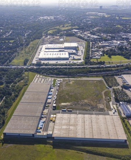 Aerial view, SEGRO Logistics Park Oberhausen, Edeka central warehouse Oberhausen and Sterkrade colliery with historic winding tower in the background in the Waldteich industrial park in the Holten district of Oberhausen, Ruhr area, North Rhine-Westphalia, Germany, DE, Europe, commercial enterprises, commercial area, industrial park, Waldteich industrial park, commercial location, commercial use, freight traffic, industrial area, industrial building, industrial location, logistics, logistics service, logistics service provider, logistics provider, logistics centre, aerial view, aerial photography, aerial photography, Oberhausen, SEGRO Parks, transport service, overview, bird's eye view, colliery, birds-eyes view, overview