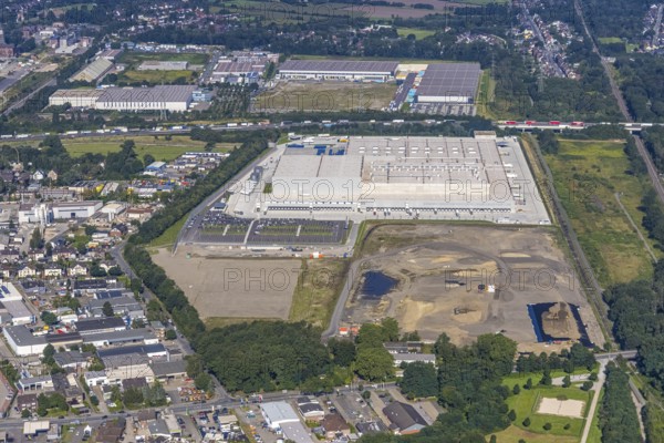 Aerial view, Edeka central warehouse Oberhausen as well as SEGRO Logistics Park Oberhausen and Lekkerland logistics centre Oberhausen in the Waldteich business park in the Schwarze Heide district of Oberhausen, Ruhr area, North Rhine-Westphalia, Germany, A3 motorway, construction area, building site, building plots, DE, Europe, commercial enterprises, commercial space, commercial area, commercial park, commercial location, commercial use, freight traffic, industrial area, industrial building, industrial location, logistics, logistics service, logistics service provider, logistics provider, logistics centre, aerial view, aerial photography, aerial photography, Oberhausen, SEGRO Parks, transport service, overview, bird's-eye view, overview