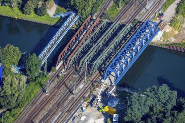 Aerial view, railway bridge construction and renovation over the Rhine-Herne Canal in Buschhausen, Oberhausen, Ruhr area, North Rhine-Westphalia, Germany, construction work, construction area, construction site, construction project, construction site, bridge, DE, railway bridge, renovation, Europe, shapes and colours, aerial view, aerial photography, aerial photography, new construction, overview, bird's eye view, birds-eyes view, coloured bridges, overview