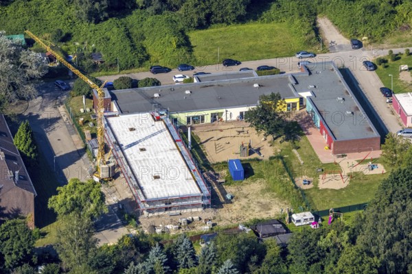 Aerial view, construction site and new building at the municip. Day care centre Holten in Oberhausen, Ruhr area, North Rhine-Westphalia, Germany, construction work, construction area, building site, building plots, construction crane, construction project, construction site, DE, Europe, kindergarten, day care centre, day care centre, day care centre, aerial photograph, aerial photography, aerial photography, new building, Oberhausen, overview, bird's-eye view, overview