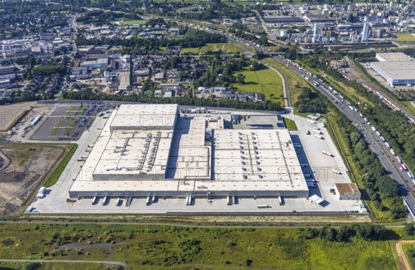 Aerial view, Edeka central warehouse Oberhausen in the district Schwarze Heide in Oberhausen, Ruhr area, North Rhine-Westphalia, Germany, DE, Europe, commercial enterprises, commercial area, commercial park, commercial location, commercial use, freight traffic, industrial area, industrial building, industrial location, logistics, logistics service, logistics service provider, logistics provider, logistics centre, aerial photograph, aerial photography, aerial photography, Oberhausen, transport service, overview, bird's eye view, birds-eyes view, overview