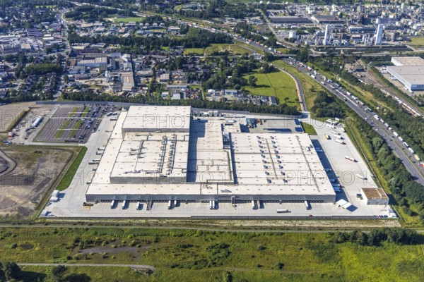 Aerial view, Edeka central warehouse Oberhausen in the district Schwarze Heide in Oberhausen, Ruhr area, North Rhine-Westphalia, Germany, DE, Europe, commercial enterprises, commercial area, commercial park, commercial location, commercial use, freight traffic, industrial area, industrial building, industrial location, logistics, logistics service, logistics service provider, logistics provider, logistics centre, aerial photograph, aerial photography, aerial photography, Oberhausen, transport service, overview, bird's eye view, birds-eyes view, overview