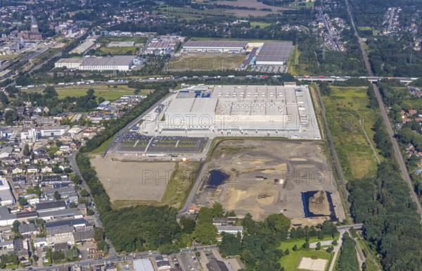 Aerial view, Edeka central warehouse Oberhausen as well as SEGRO Logistics Park Oberhausen and Lekkerland logistics centre Oberhausen in the Waldteich business park in the Schwarze Heide district of Oberhausen, Ruhr area, North Rhine-Westphalia, Germany, A3 motorway, construction area, building site, building plots, DE, Europe, commercial enterprises, commercial space, commercial area, commercial park, commercial location, commercial use, freight traffic, industrial area, industrial building, industrial location, logistics, logistics service, logistics service provider, logistics provider, logistics centre, aerial view, aerial photography, aerial photography, Oberhausen, SEGRO Parks, transport service, overview, bird's-eye view, overview