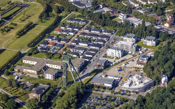 Aerial view, winding tower and Steigerhaus as well as ASO Oberhausen senior citizens' residence at OLGA Park and construction site and new residential buildings Auf dem Schacht and Vestische Straße corner Zum Steigerhaus at OLGA Park in Osterfeld, Oberhausen, Ruhr area, North Rhine-Westphalia, Germany, construction work, construction area, construction site, building plots, construction project, construction site, DE, Europe, property tax, real estate, aerial view, aerial photography, aerial photography, new construction, overview, bird's-eye view, residential complex, living and living, residential area, residential buildings, residential quality, residential neighbourhood, housing estate, birds-eyes view, overview