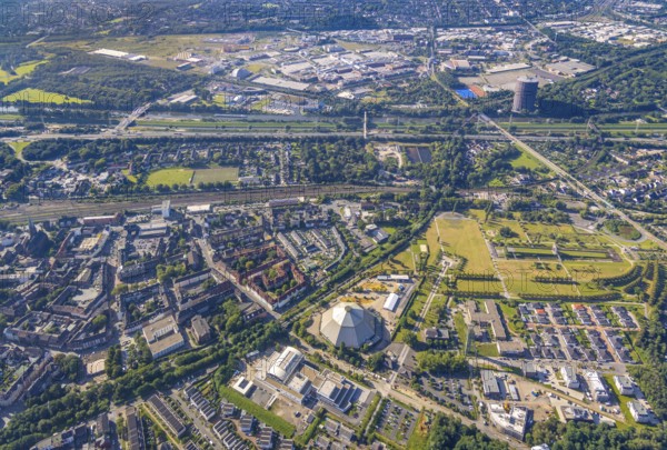 Aerial view, OLGA Park with ASO Oberhausen senior citizens' residence at OLGA Park, winding tower and old Steigerhaus as well as garden dome, in the background the Centro Oberhausen shopping centre in Osterfeld in Oberhausen, Ruhr area, North Rhine-Westphalia, Germany, DE, shopping centre, shopping mall, shopping mile, shopping markets, shopping place, shopping centre, Europe, leisure park, culture, art, aerial view, aerial photography, aerial photography, Oberhausen, park, shopping, shopping centre, overview, event location, event venue, event centre, bird's-eye view, birds-eyes view, former Osterfeld colliery and coking plant, cultural use, overview