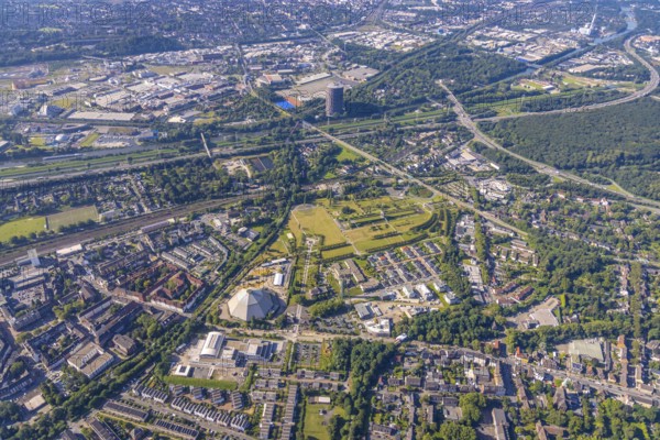 Aerial view, OLGA Park with ASO Oberhausen senior citizens' residence at OLGA Park, winding tower and old Steigerhaus as well as garden dome, in the background the Centro Oberhausen shopping centre in Osterfeld in Oberhausen, Ruhr area, North Rhine-Westphalia, Germany, DE, shopping centre, shopping mall, shopping mile, shopping markets, shopping place, shopping centre, Europe, leisure park, culture, art, aerial view, aerial photography, aerial photography, Oberhausen, park, shopping, shopping centre, overview, event location, event venue, event centre, bird's-eye view, birds-eyes view, former Osterfeld colliery and coking plant, cultural use, overview