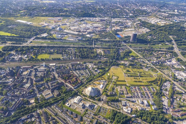 Aerial view, OLGA Park with ASO Oberhausen senior citizens' residence at OLGA Park, winding tower and old Steigerhaus as well as garden dome, in the background the Centro Oberhausen shopping centre in Osterfeld in Oberhausen, Ruhr area, North Rhine-Westphalia, Germany, DE, shopping centre, shopping mall, shopping mile, shopping markets, shopping place, shopping centre, Europe, leisure park, culture, art, aerial view, aerial photography, aerial photography, Oberhausen, park, shopping, shopping centre, overview, event location, event venue, event centre, bird's-eye view, birds-eyes view, former Osterfeld colliery and coking plant, cultural use, overview