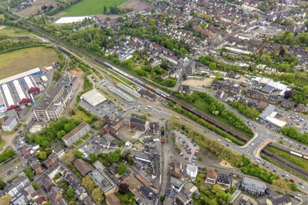 Aerial view, railway station and bus station, biomass cogeneration plant of Energieversorgung Oberhausen AG, Sterkrade Mitte, Oberhausen, Ruhr area, North Rhine-Westphalia, Germany, railway tracks, railway station, bus stop, DE, Deutsche Bahn AG, Europe, main station, power station, aerial view, aerial photography, aerial photography, overview, bird's eye view, ZOB, birds-eyes view, overview