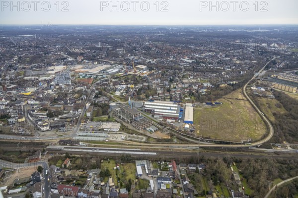 Aerial view, railway station and bus station, biomass cogeneration plant of Energieversorgung Oberhausen AG, Gutehoffnungshütte Radsatz, view of Sterkrade Mitte, Oberhausen, Ruhr area, North Rhine-Westphalia, Germany, railway tracks, railway station, bus stop, DE, Deutsche Bahn AG, Europe, main station, power station, aerial view, aerial photography, aerial photography, overview, bird's-eye view, ZOB, birds-eyes view, overview
