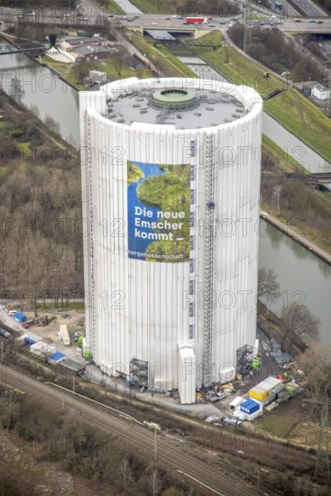 Aerial view, gasometer renovation measures, covered gasometer at CentrO, poster The Emscher is coming, Rhine-Herne Canal. River Emscher, Borbeck, Oberhausen, Ruhr area, North Rhine-Westphalia, Germany, DE, Europe, industrial monument, culture, art, aerial view, aerial photography, aerial photography, overview, events, venue, event location, event centre, bird's eye view, birds-eyes view, cultural use, overview